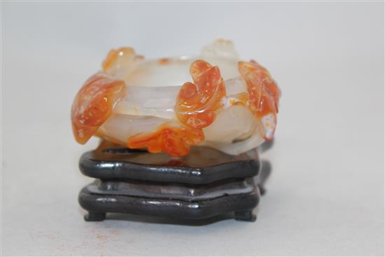 A Chinese chalcedony brush washer, 19th / 20th century, 8.4cm, wood stand